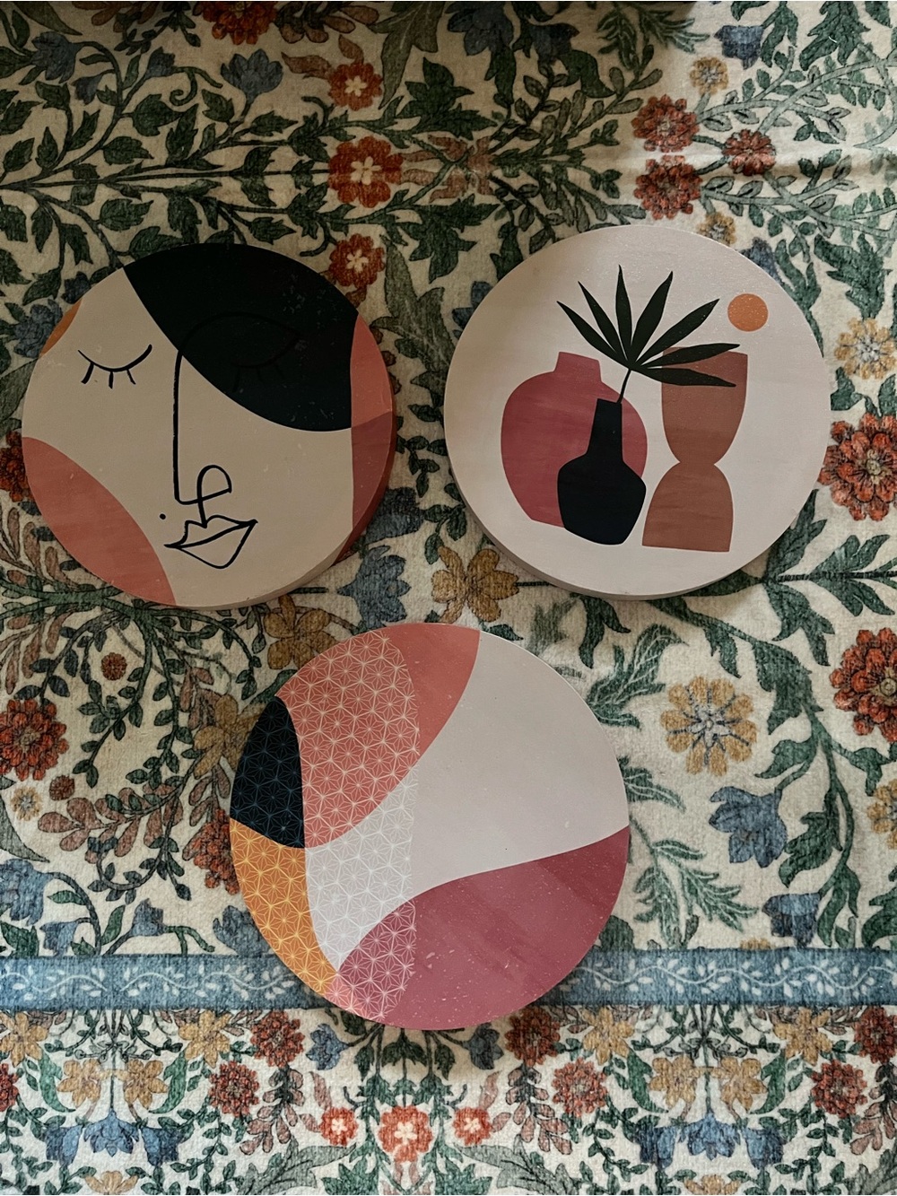 Set of three circular canvases